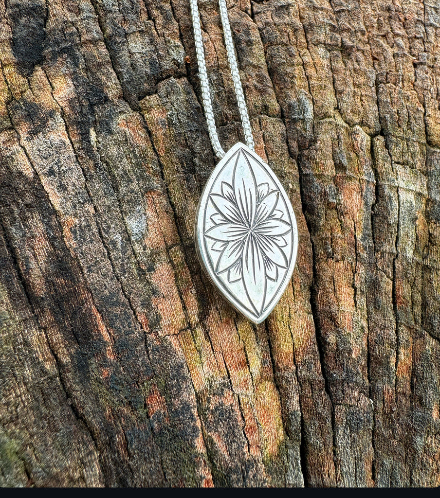 Purple sapphire and green garnet pendant