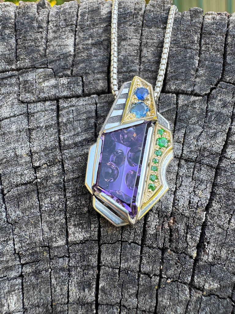 Amethyst, sapphire, and garnet pendant