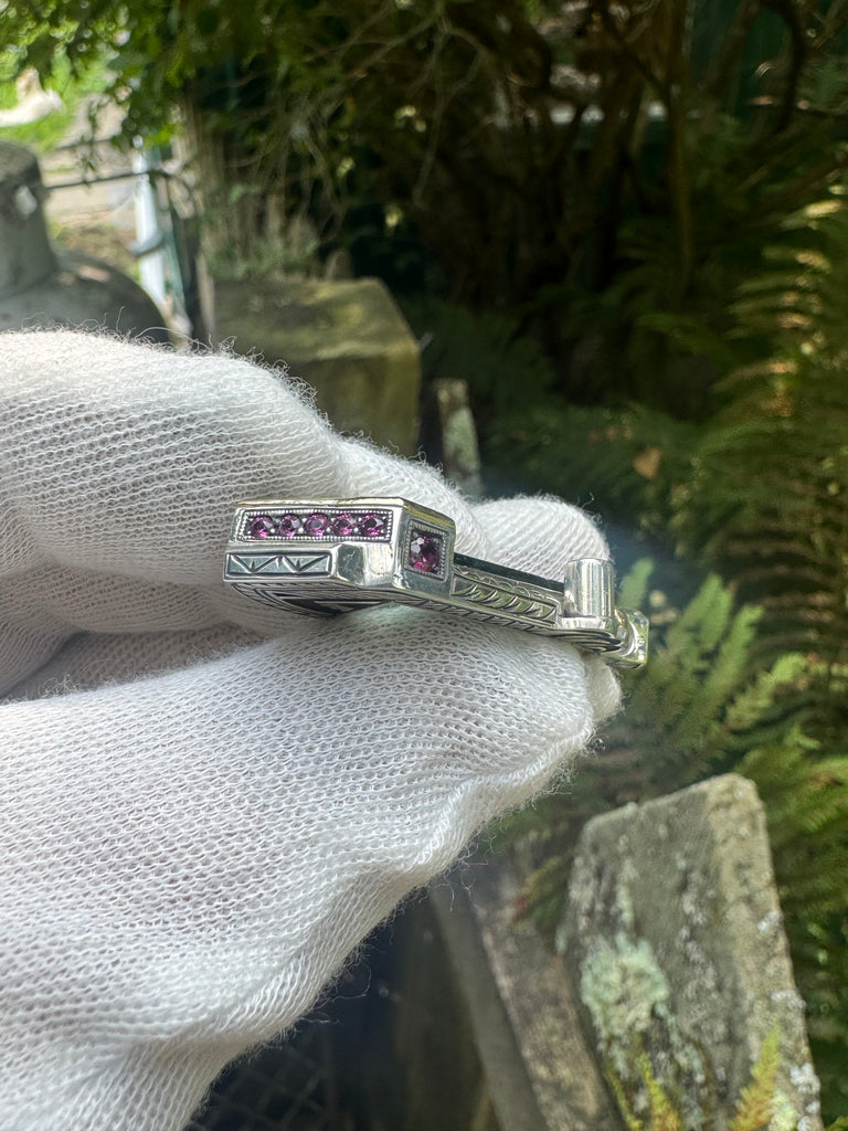 Blue tourmaline, garnet, and sapphire pendant