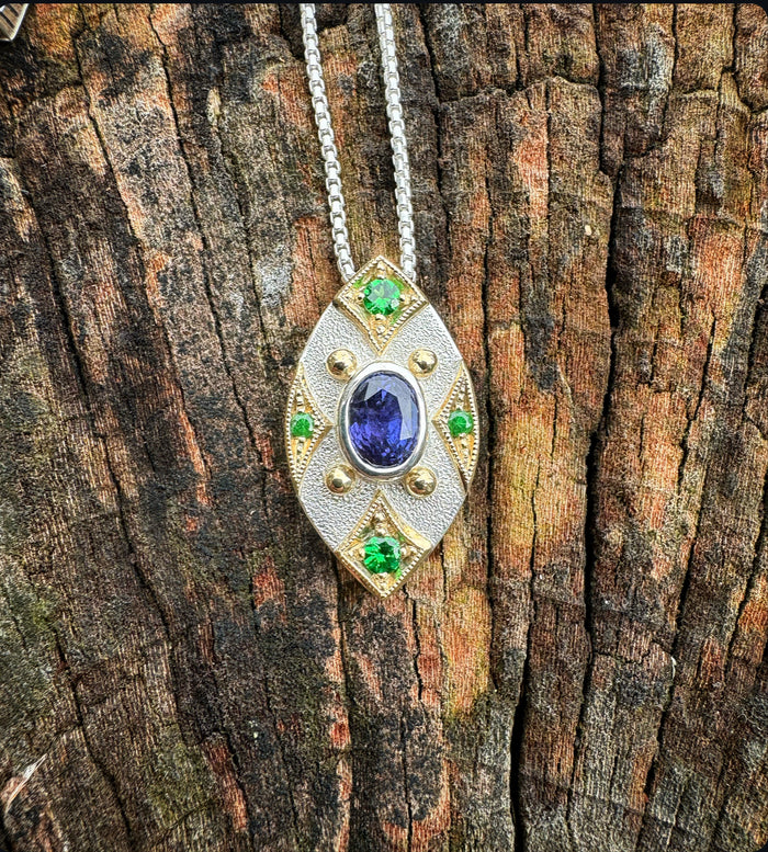 Purple sapphire and green garnet pendant