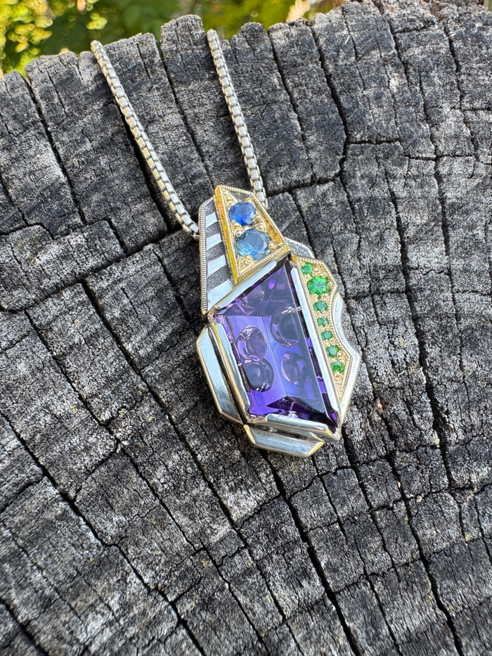 Amethyst, sapphire, and garnet pendant