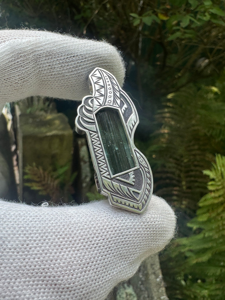 Blue tourmaline, garnet, and sapphire pendant