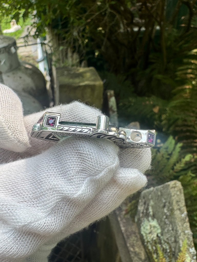 Blue tourmaline, garnet, and sapphire pendant