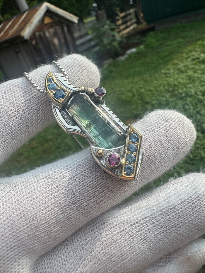 Blue tourmaline, garnet, and sapphire pendant