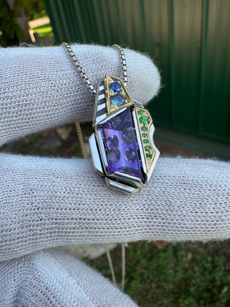 Amethyst, sapphire, and garnet pendant