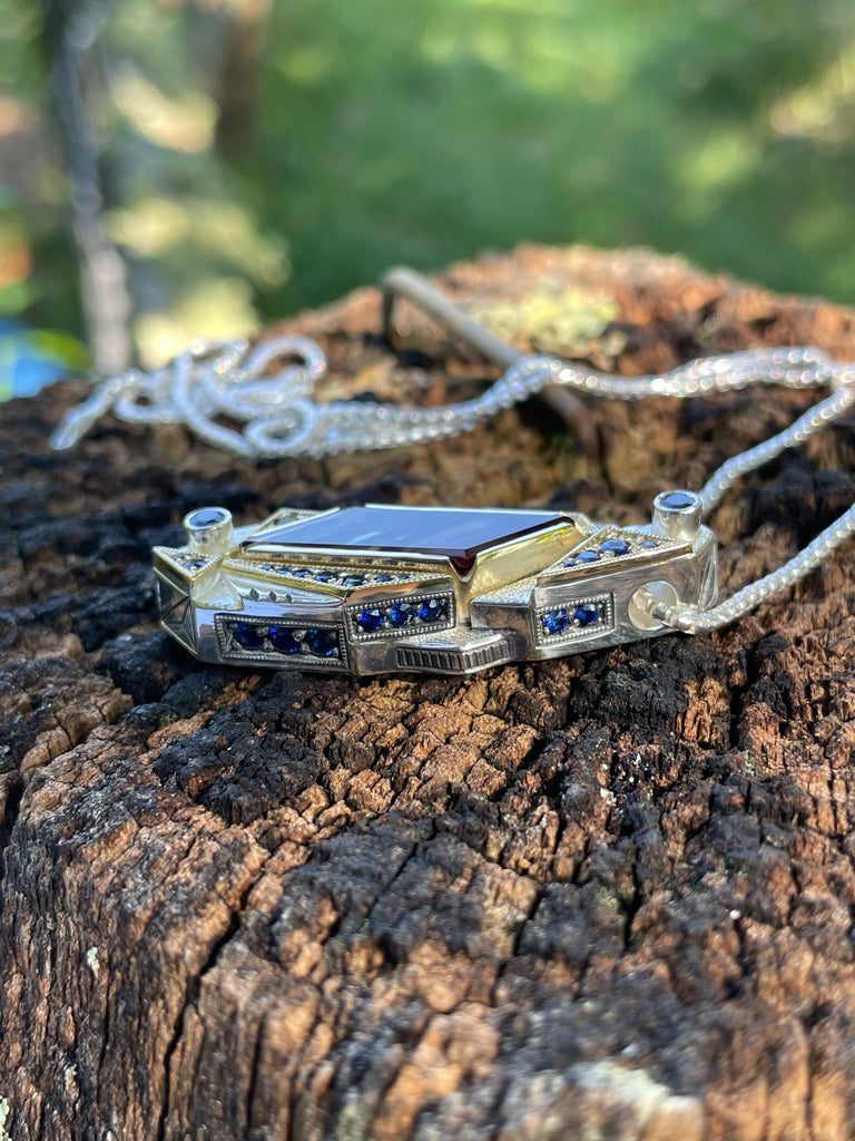 Soul Retrieval - Oregon sunstone and sapphire pendant