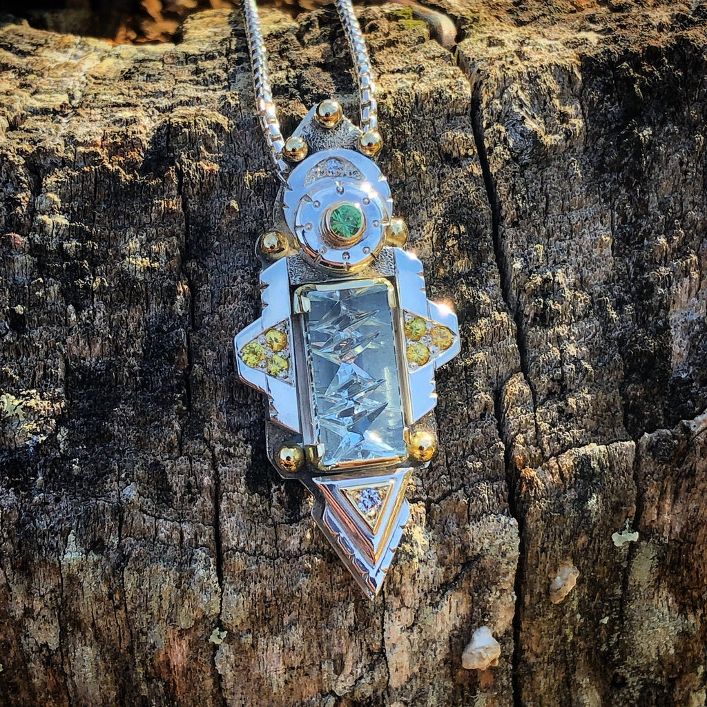 Aquamarine, yellow sapphire, diamond, and green garnet pendant