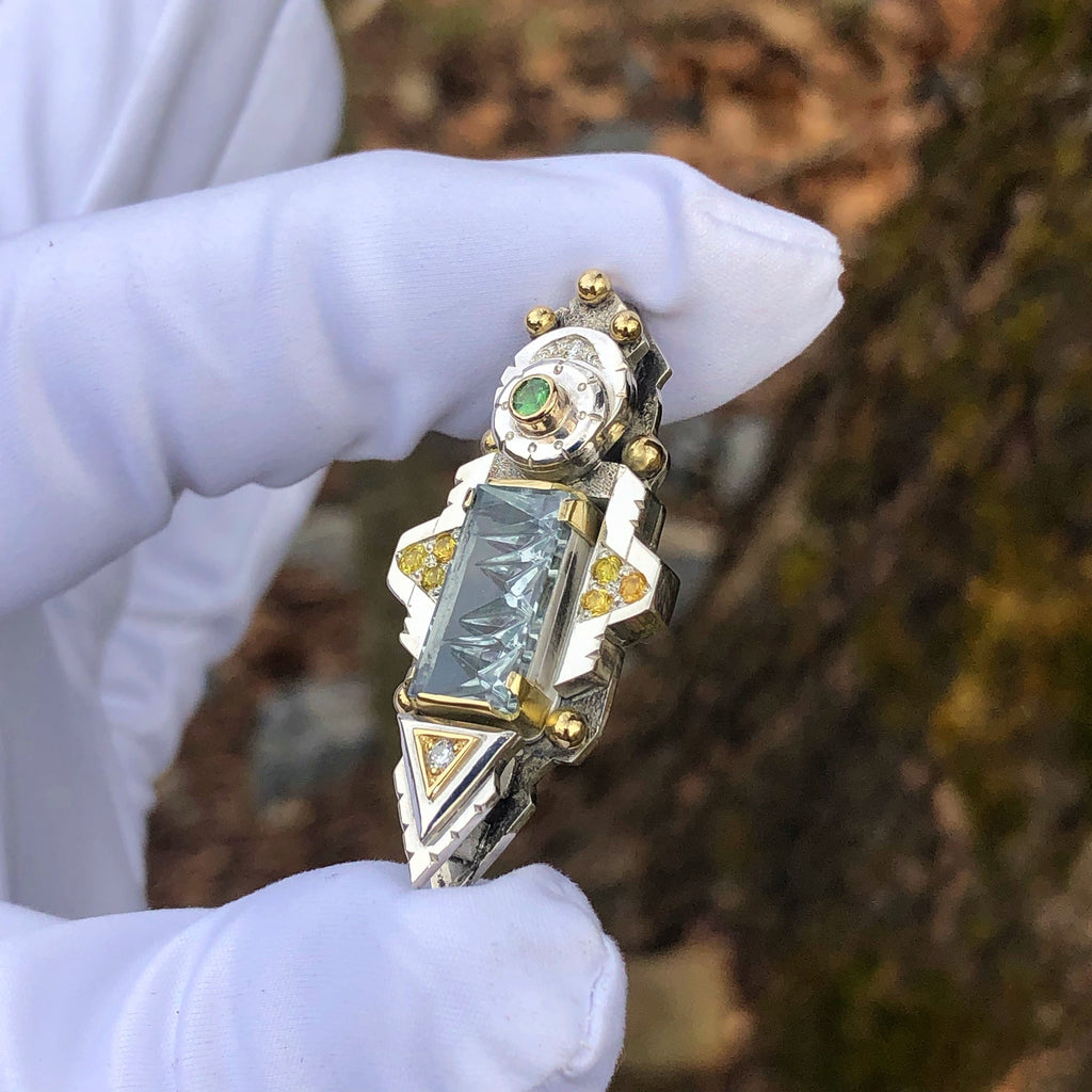 Aquamarine, yellow sapphire, diamond, and green garnet pendant